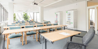Empty classroom full of natural light.